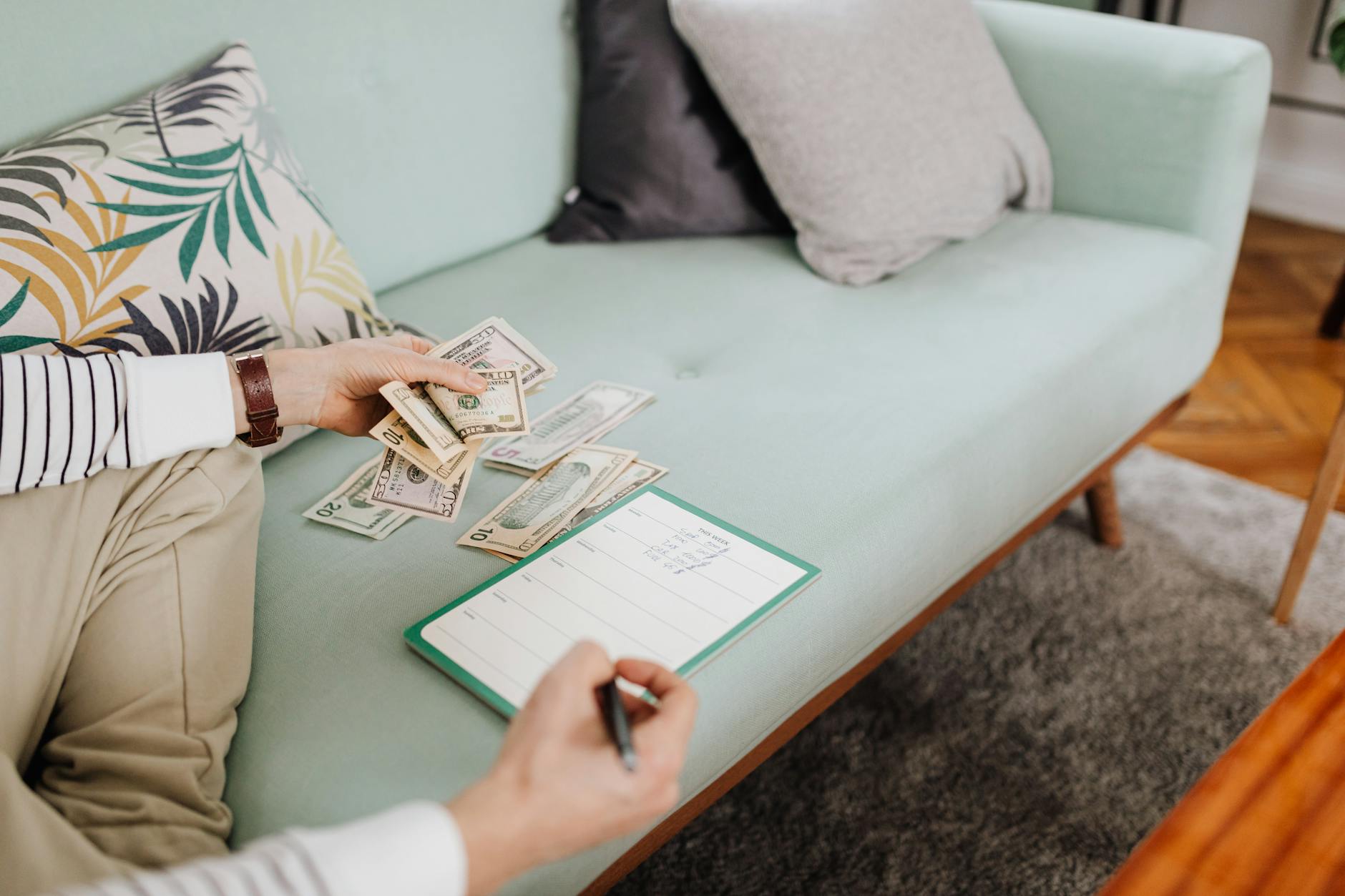 An editorial-style side hustle workspace with planning notes, laptop, and income ideas