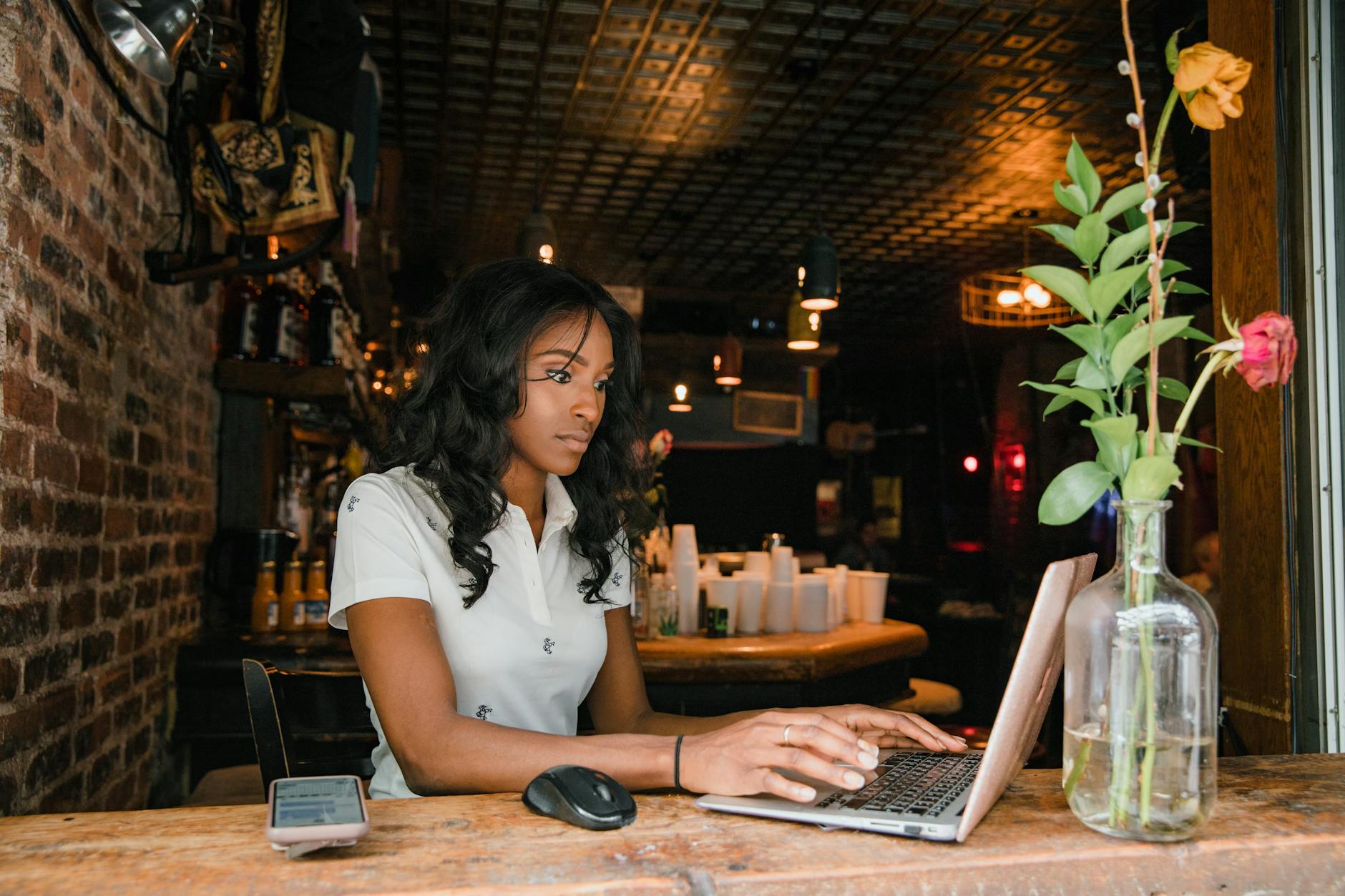 A laptop with notes comparing realistic online side hustle options